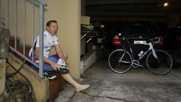 Tip-tap tiptoe: Prime minister-elect Tony Abbott prepares for a ride on Sunday morning.