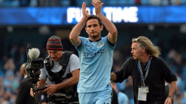 Lampard applauds the Chelsea supporters after scoring against his former club.