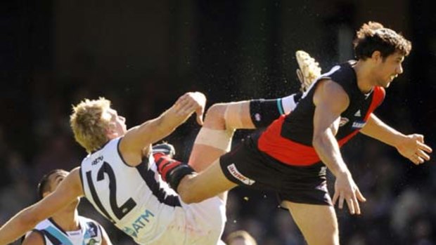 Port's Jackson Trengove and Essendon's Paddy Ryder do battle in the air yesterday.