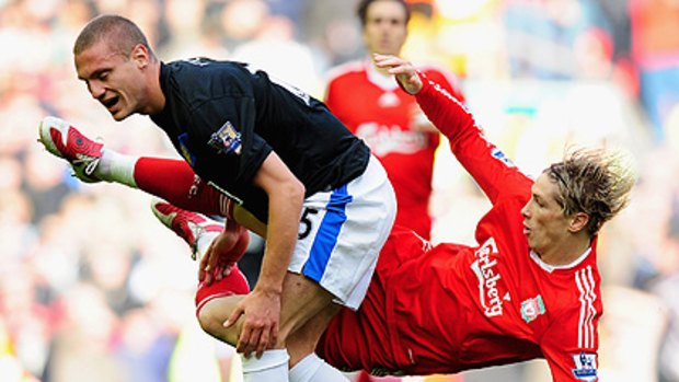 Danger man ... Nemanja Vidic  tangles with Fernando Torres of Liverpool last year.