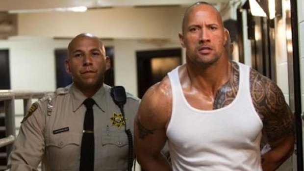 Out for justice: A prison guard escorts a largely wordless Dwayne "The Rock" Johnson to freedom so he can avenge his murdered brother in the surprisingly good actioner Faster.