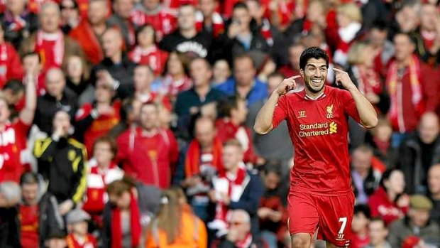 Hat-trick hero: Luis Suarez celebrates  his second of three goals for Liverpool against West Bromwich Albion.