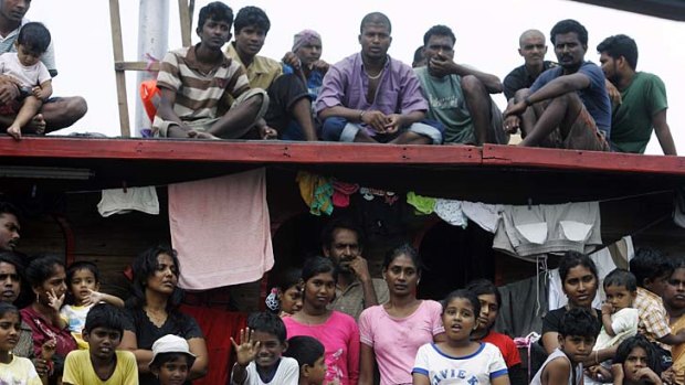 The long journey ahead: Sri Lankan asylum seekers look from a boat during an attempted journey to Australia.