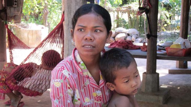 Beaten and robbed &#8230; Orn Eak has returned to her village home and her five-year-old son but is still scarred by her mistreatment in Kuala Lumpur and Phnom Penh.