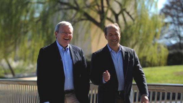 He's back... Kevin Rudd and the US Ambassador Jeff Bleich share a walk around Lake Burley Griffin in Canberra.