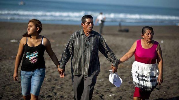 Dreaming of a reunion: Alvarenga's daughter Fatima Mabea, left, with his parents Jose Ricardo Orellana and Maria Julia Alvarenga.