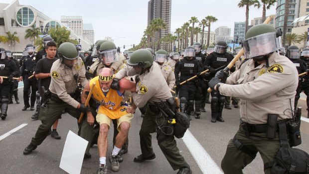 An anti-Trump protester is arrested outside a Trump rally at the San Diego Convention Center.