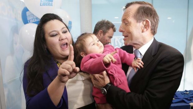 Snubbed: Tony Abbott tries to kiss Carmen Garcia's daughter.