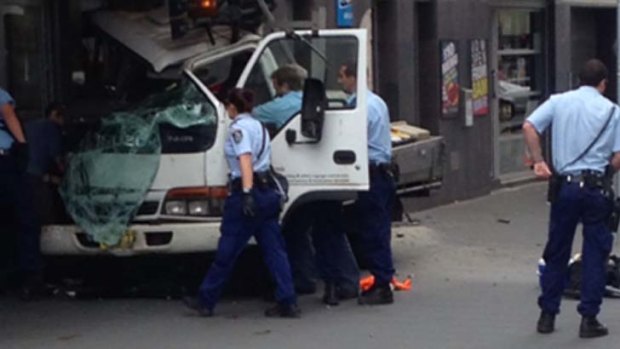 Man shot ... his truck crashed into the outside of a hotel.