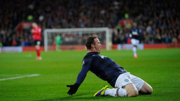 Wayne Rooney celebrates scoring the opening goal.
