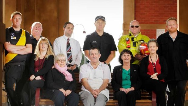 Garry Higgins (front row, centre) with Maryborough residents who are taking a stand on domestic violence.
