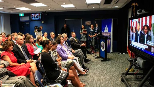 US Ambassador John Berry and selected guests watch President Obama give the State of the Union address at the US Embassy in Canberra.