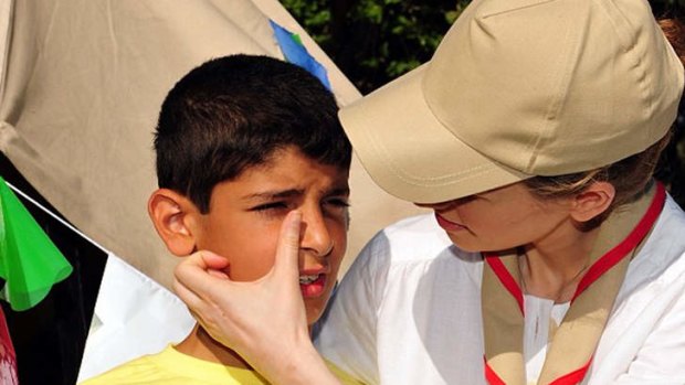 The official Instagram account of the Syrian Presidency purports to show first lady Asma Assad comforting a child at a 2012 visit to Dar Zeid Bin Haretha camp at a shooting club in Damascus, Syria.