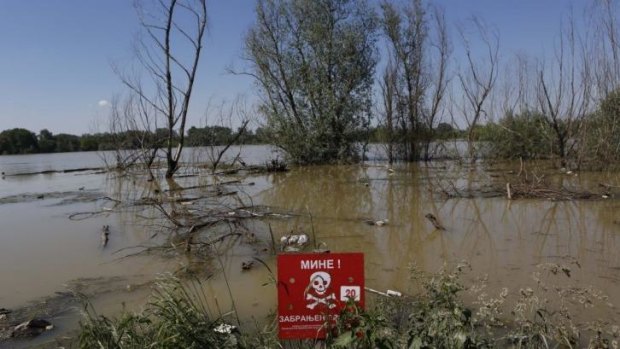 A red sign that reads "Mine Field" sits on the shore of river Sava some 200 kilometres north of Sarajevo. Officials have warned about the risk posed by some of the estimated 120,000 mines from the 1992-95 war being washed away.