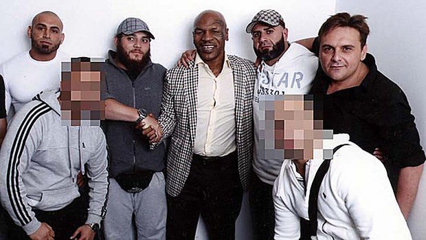 Khaled Sharrouf, third from left, shakes hands with Mike Tyson. George Alex is on the far right wearing a black shirt.