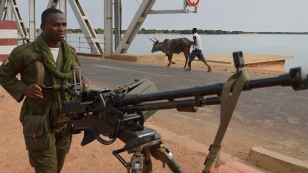 A Malian soldier holds a machine gun near Markala, 270km north of Bamako. AFP