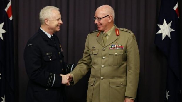 Incoming Chief of the Defence Force, Air Marshal Mark Binskin, is congratulated by outgoing chief General David Hurley.