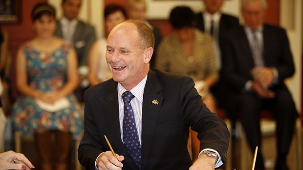 Campbell Newman laughs with Queensland Governor Penelope Wensley while being sworn in as Premier.