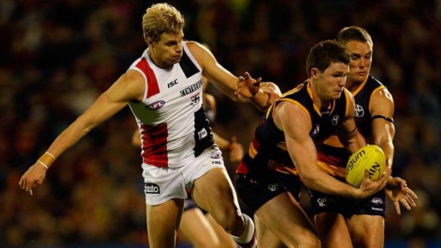 Crow Patrick Dangerfield comes under pressure from Nick Riewoldt.