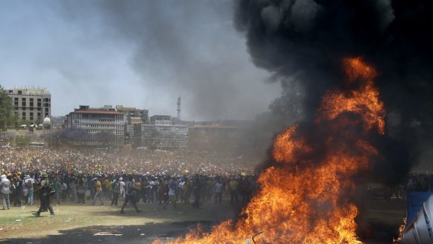 Students burn portable toilets to protest against university tuition hikes in Pretoria.