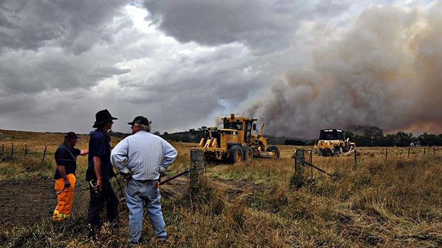 Kybeyan Road near Cooma ... heavy machinery is used to prepare a fire break.