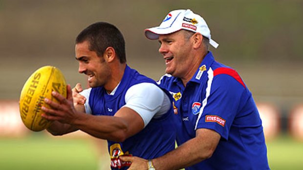 Daniel Giansiracusa and hands-on coach Rodney Eade at Western Bulldogs training yesterday.