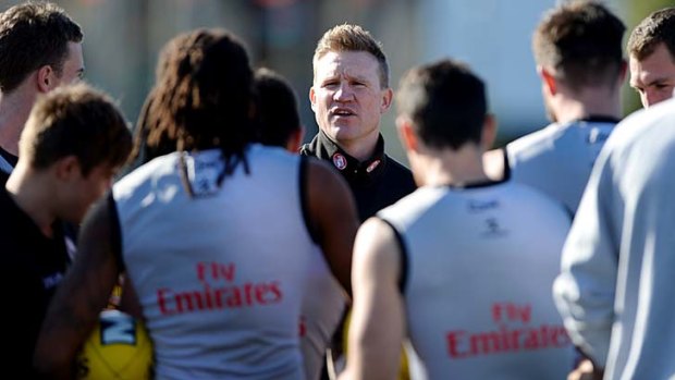 Collingwood coach Nathan Buckley addressing his players at training.