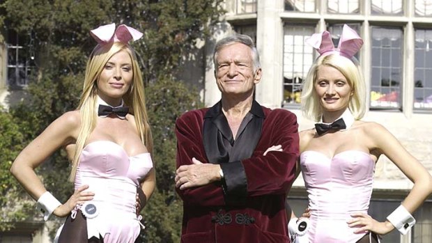 Playboy bunny Sheila Levell, Playboy founder Hugh Hefner and Playboy bunny Holly Madison at the Playboy Mansion in 2003.