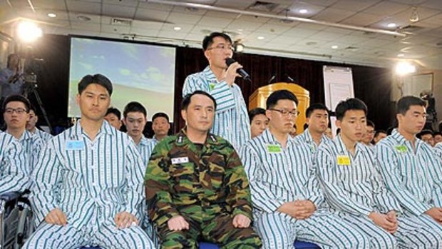 Choi Won-Il, captain of the sunken South Korean warship Cheonan with surviving crew members.