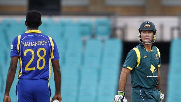 Sent packing: Ricky Ponting looks at Farveez Maharoof after being dismissed in Australia's loss to Sri Lanka last night.