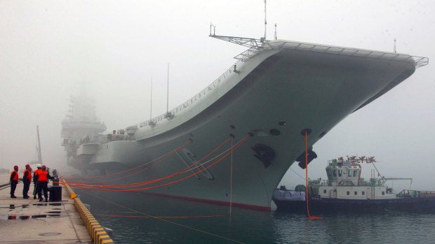 China's aircraft carrier, the Liaoning, anchored in the northern port in Qingdao, east China's Shandong Province. 