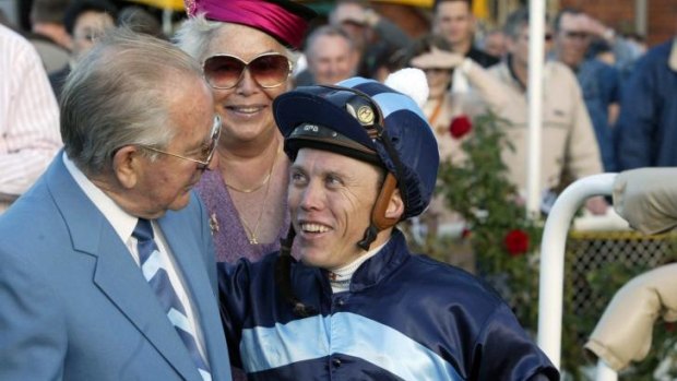 Long career: Trevor Stuckey celebrates a Reigning to Win victory with Melbourne Cup-winning jockey Chris Munce in 2006.