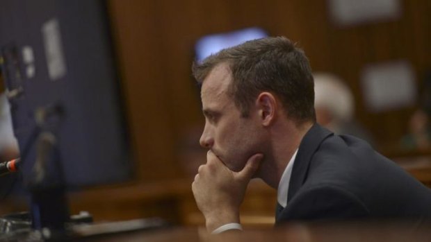 Oscar Pistorius listens to evidence being presented on the shooting death of his girlfriend Reeva Steenkamp during the second week of his murder trial.