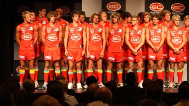 Players display the provisional Gold Coast uniform, 31 March 2009.