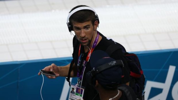 All hail ... Michael Phelps arrives at the Olympic pool.
