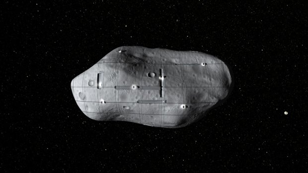 A computer-generated rendering of several small robotic spacecraft mining a potential near-Earth asteroid.
