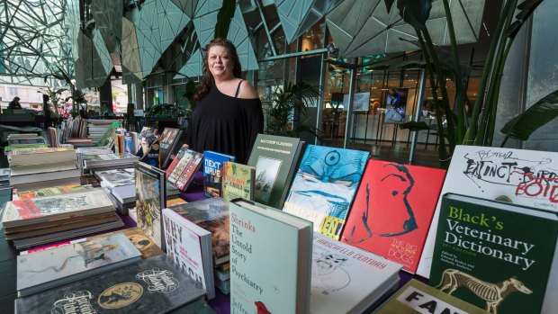 Rose Rennes sells books at Federation Square.