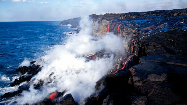 Lava reaches the ocean In Volcano National Park, Hawaii.