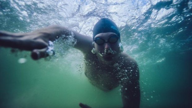 Marathon man: Lochie Hinds  has completed the Triple Crown of long-distance swimming.