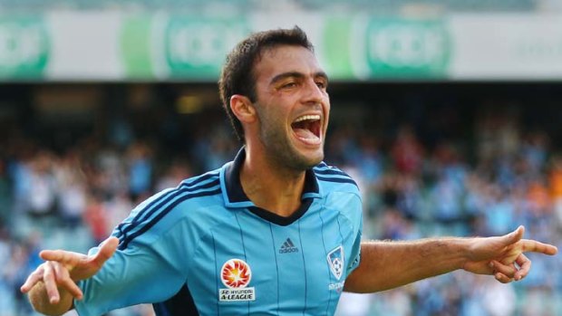 The clincher: Sydney's Bruno Cazarine celebrates his goal that sealed victory against Gold Coast yesterday.