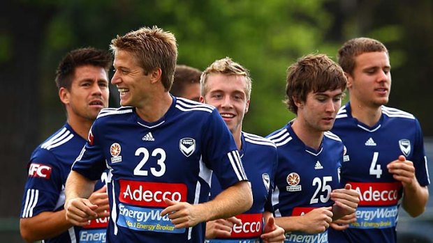 Melbourne Victory players warm up during a training session at Gosch's Paddock on Thursday.