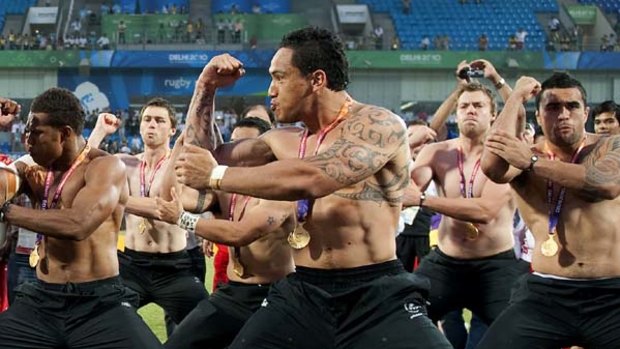 New Zealand's rugby players perform the haka after winning the gold medal.