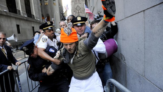 Police make an arrest on Wall Street during the Occupy Wall Street protest in New York.