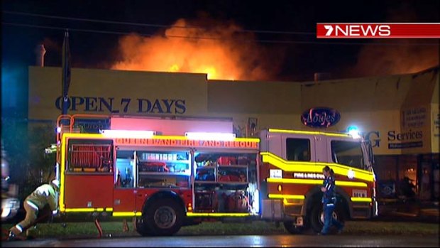 Fire tears through the Lowes Dry Cleaning building.