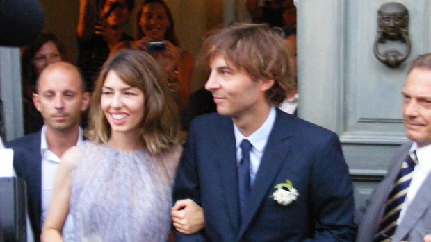 Sofia Coppola and Thomas Mars leave after their wedding ceremony in Bernalda.