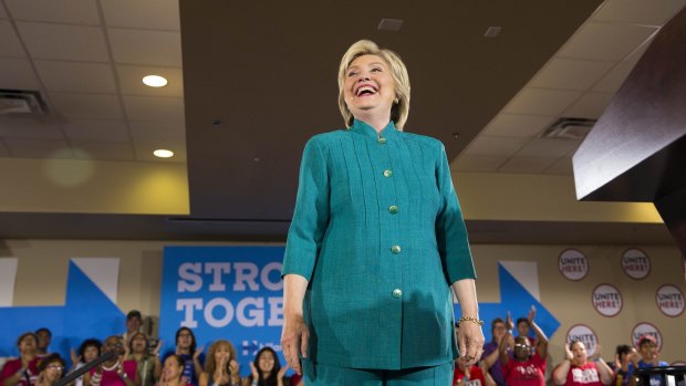 Hillary Clinton has added colour to her preferred fashion choice of trouser suits.