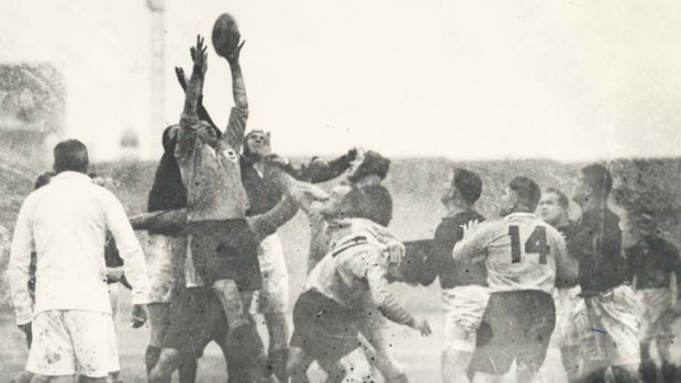 Players jostle for possession during the 1937 clash.