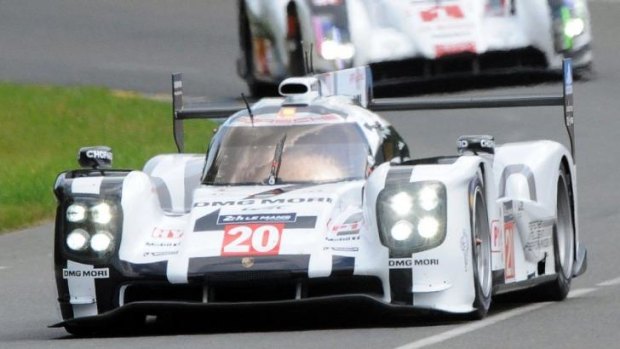 Charge: Mark Webber puts his Porsche through its paces at Le Mans ahead of the 24-hour classic.