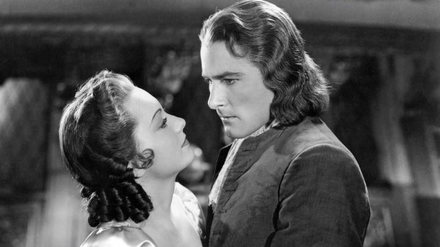 Tassie devil: Olivia de Havilland with Errol Flynn in Captain Blood. In their eight co-starring movies they had on-screen magic, despite their off-screen meh.