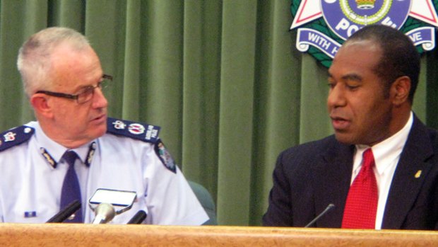 Queensland Police Commissioner Bob Atkinson and FBI agent Arnold Bell address a media conference on Brisbane.
